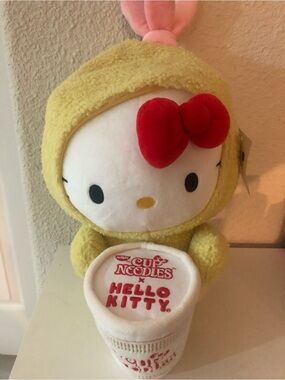 Hello Kitty Plush in Yellow Costume with Red Bow and White Cup Noodles Accessory